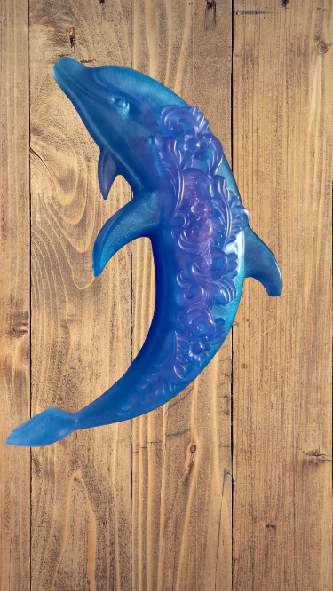 Dauphin bleu avec du rose phosphorescent